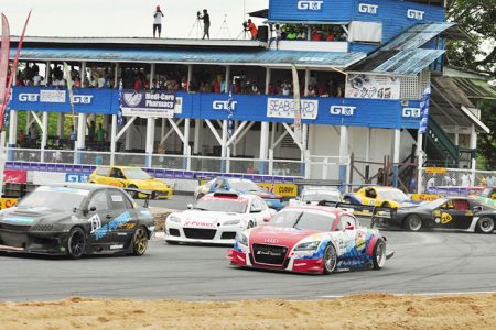 7.	Mark Vieira (centre) in third before he eventually sped his way to victory after overtaking his Jamaican counterpart Doug Gore (right) and fellow Guyanese Kevin Jeffrey (front)