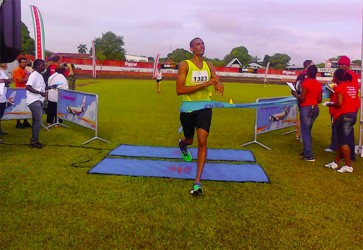 Lionel D’Andrade crossing the finishing line to clinch the top spot in the men’s open division of the Suriname Marathon  