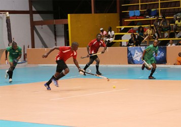 Old Fort’s Aderemi Simon (centre) on the attack as Shane Samuels (left) of Hikers pursue in their first division matchup