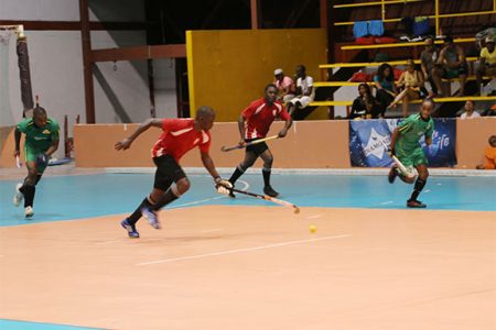 Old Fort’s Aderemi Simon (centre) on the attack as Shane Samuels (left) of Hikers pursue in their first division matchup