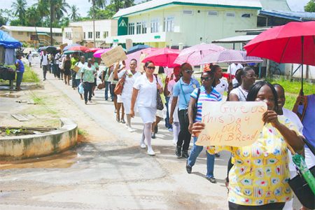 Linden public servants along Republic Avenue during a march organised yesterday to protest against the 5% public servant wage increase.
