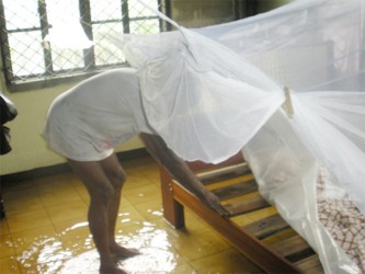 Clarence Scott’s shows his make-shift bed in the flooded bottom flat of his Sophia home