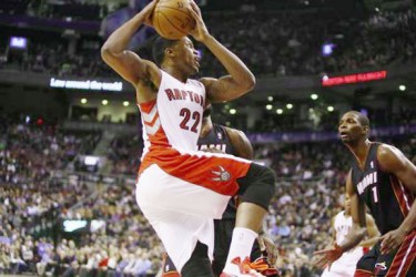 Toronto, Ontario, CAN; Toronto Raptors forward Rudy Gay (22) goes up to shoot as Miami Heat center-forward Chris Bosh (1) looks on at the Air Canada Centre. Miami defeated Toronto 90-83. (John E. Sokolowski-USA TODAY Sports) 