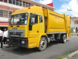 Minister within the Ministry of Local Government and Regional Development, Norman Whittaker yesterday handed over the keys to a compactor truck valued $3.8M to the Mon Repos/Reconnaissance Neighbourhood Democratic Council (NDC) to aid in the area’s garbage disposal. (GINA photo)