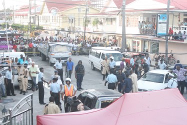 Verandahs and roofs were crowded with persons trying to find the best vantage point during the siege on Middle Street yesterday. These persons were apparently oblivious to the dangers they faced. A large crowd had also gathered on the road.