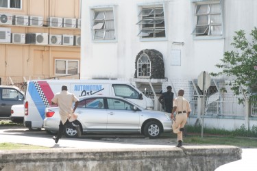 Policemen running for strategic positions.