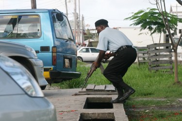 Watch your step – a policeman about to move into the siege area