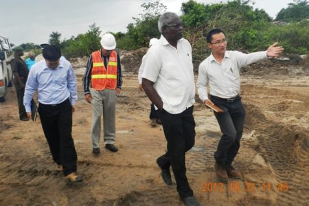 Works Minister Robeson Benn (second from right) touring the site. (CJIAC photo)