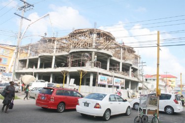 Construction work on the City Food Court continued as normal after at least three men fell from one floor to the next and sustained injuries. (Photo by Arian Browne) 