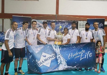 Men’s first division champions Revamp Hockey Club of Canada collecting their championship trophy following their emphatic win over Trinidad and Tobago’s Queens Park in the men’s first division final. 