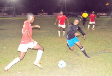 Riddim Squad’s Teon Jones (left) challenging Mahaica Determinators Azuma Roberts (right) for possession of the ball    