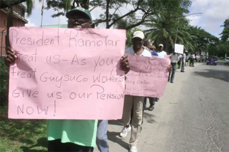 Former GTC and GT&T workers demonstrating in front of the Office of the President yesterday (Photo by Arian Browne)