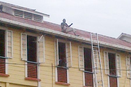  Delon King sits on the gutter of one of the Palms’ buildings as he spoke to the institution’s administrators
