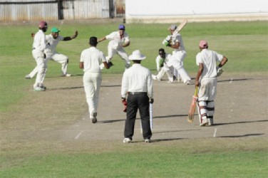 At the Enmore Community Centre ground, batsman Rovindra Parsram is caught behind off the bowling of spinner Amir Khan 