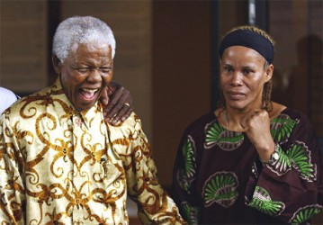 Guyana’s first female world boxing champion, Gwendolyn ‘Stealth Bomber’ O’Neil stands with Nelson Mandela during the promotion of her 2007 title fight versus Laila Ali. 