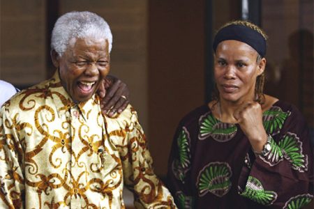 Guyana’s first female world boxing champion, Gwendolyn ‘Stealth Bomber’ O’Neil stands with Nelson Mandela during the promotion of her 2007 title fight versus Laila Ali.
