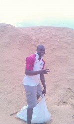 This man was picking up waste paddy to throw in his cow pen  