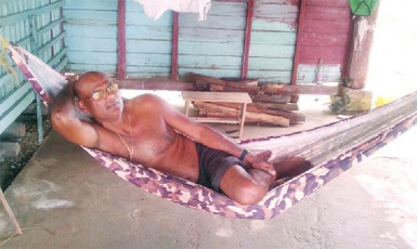 Deonarine Ramnarine reclining in his hammock  