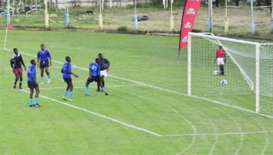 Romel Legall (extreme left) finds the back of the net for East Ruimveldt Secondary on the stroke of halftime. (Orlando Charles photo) 