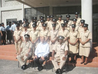 Sitting in the front from left are: Commissioner of Police Leroy Brumell DSM, Minister of Home Affairs Clement Rohee and Force Training Officer P Williams. They are flanked by participants from the Junior Officers’ Course.  