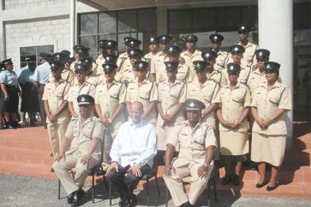 Sitting in the front from left are: Commissioner of Police Leroy Brumell DSM, Minister of Home Affairs Clement Rohee and Force Training Officer P Williams. They are flanked by participants from the Junior Officers’ Course.
