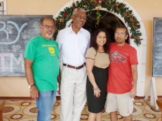 This APNU photo shows David Granger (second from left) with members of the centre. 