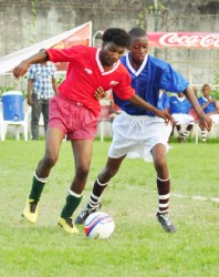 Patentia’s goal scorer, Kenton Boyce (left) in action during his side’s loss to North Georgetown. (Orlando Charles photo) 