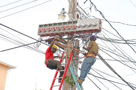 Technicians placing meters on poles. Whether this will be permanent is yet to be determined.
