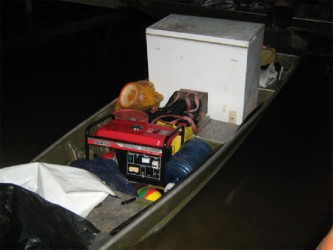 The aluminium boat with the freezer and generator that were confiscated during the operation. (Photo courtesy of the Ministry of Natural Resources and the Environment)