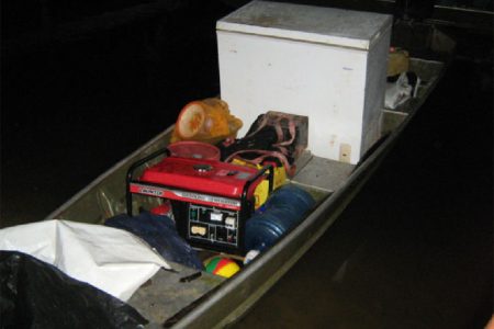 The aluminium boat with the freezer and generator that were confiscated during the operation. (Photo courtesy of the Ministry of Natural Resources and the Environment)