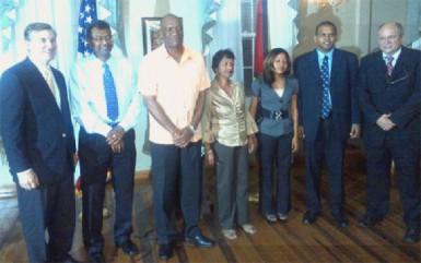 Chief of Party for the USAID Leadership and Democracy (LEAD) project Glenn Bradbury  (right) with Members of Parliament and US Ambassador to Guyana Brent Hardt (left) at the launching of the project in July. (SN file photo) 