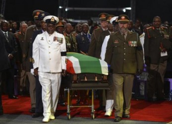 The coffin carrying former South African President Nelson Mandela is escorted in his funeral ceremony in Qunu December 15, 2013.  REUTERS/Odd Andersen/Pool