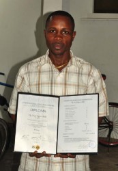 Sebert Blake with his International Coaching Course Diploma in hand. (Orlando Charles photo) 