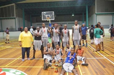 The victorious Kwakwani Secondary side posing with their medals and championship trophies after their huge win over the University of Guyana