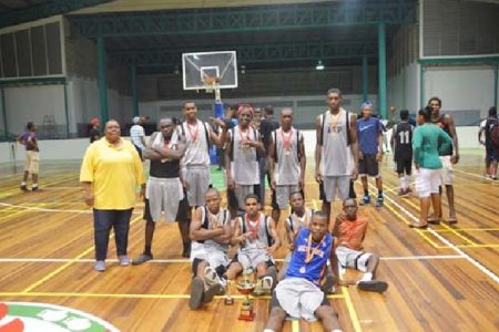 The victorious Kwakwani Secondary side posing with their medals and championship trophies after their huge win over the University of Guyana