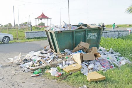Eyesore: The seawall bandstand within striking distance of this unsightly garbage heap.