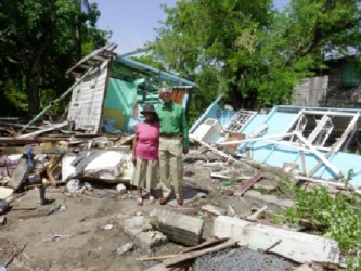 David Granger and Doris Nero amid the ruins of her house 