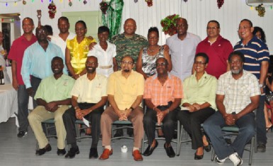 President of the GOA, K.A Juman-Yassin (seated third from left) is flanked by his executives and heads of the associations that received monetary gifts for the development of young athletes at the holiday social on Wednesday night. (Orlando Charles photo) 