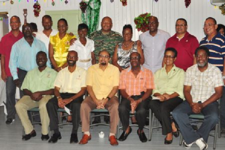 President of the GOA, K.A Juman-Yassin (seated third from left) is flanked by his executives and heads of the associations that received monetary gifts for the development of young athletes at the holiday social on Wednesday night. (Orlando Charles photo)
