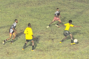 Action during St. George’s 4-1 victory over East Ruimveldt yesterday at the GFC ground. (Orlando Charles photo)