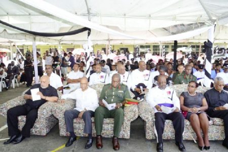 (From left) President Donald Ramotar, Home Affairs Minister Clement Rohee , Chief of Staff of the Guyana Defence Force Brigadier Mark Phillips, Police Commissioner Leroy Brummel, a relative of Derrick Josiah, and Opposition Leader David Granger among the gathering at the funeral of the late Assistant Police Commissioner on Saturday. (GINA photo)