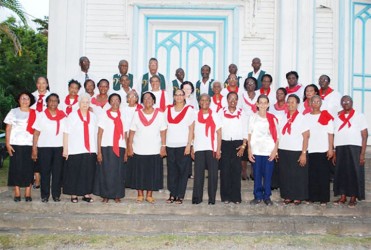  Members of the Woodside Choir pose outside Christ Church in 2012 when they celebrated the choir’s 60th anniversary.