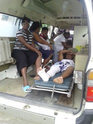 One of the injured persons being taken to hospital
