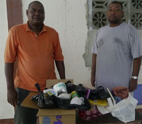 Hilbert Foster and a member after selecting the items for Durjan Hilbert Foster