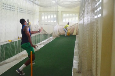 Two members of the Guyana team going through their paces at the Chetram Singh Centre of Excellence indoor facility yesterday.