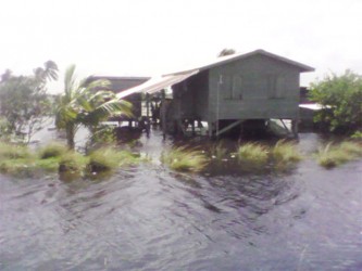 Island home: This house is completely surrounded by water which residents said was five inches in some places and up to one and a half feet in others.  
