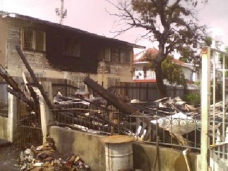What was left of the building after the fire and the burnt section of Dr Ghansham Singh’s building