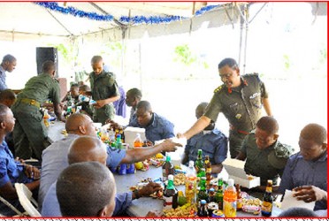 At Coast Guard Ship Hinds, Colonel General Staff, Colonel Kemraj serves lunch to the troops.