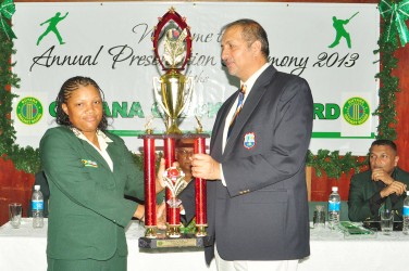 June Oagle Recieves the female cricketer award of the year from Baldath Mahobir