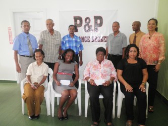 P&P Insurance Brokers & Consultants Limited yesterday donated $100,000 to each of ten organisations. These are the Bless the Children Home, Canaan Children Home, Hauraruni Girls Home, Ptolemy Reid Rehab Centre, Uncle Eddie’s Home,  Archer’s Home, the Dharm Shala, David Rose School for the Handicapped,  Cheshire Homes Guyana,  Bright Horizon Family. Representatives of the organisations are flanked by Mr. & Mrs.  Bish Panday (standing), Directors of P&P Insurance Brokers & Consultants Limited.